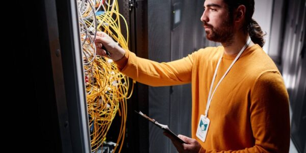 bearded-technician-working-with-server-network-and-connecting-cables-e1736826334595 (1) bearded-technician-working-with-server-network-and-connecting-cables-e1736826334595 (1)